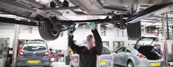 Technician under car